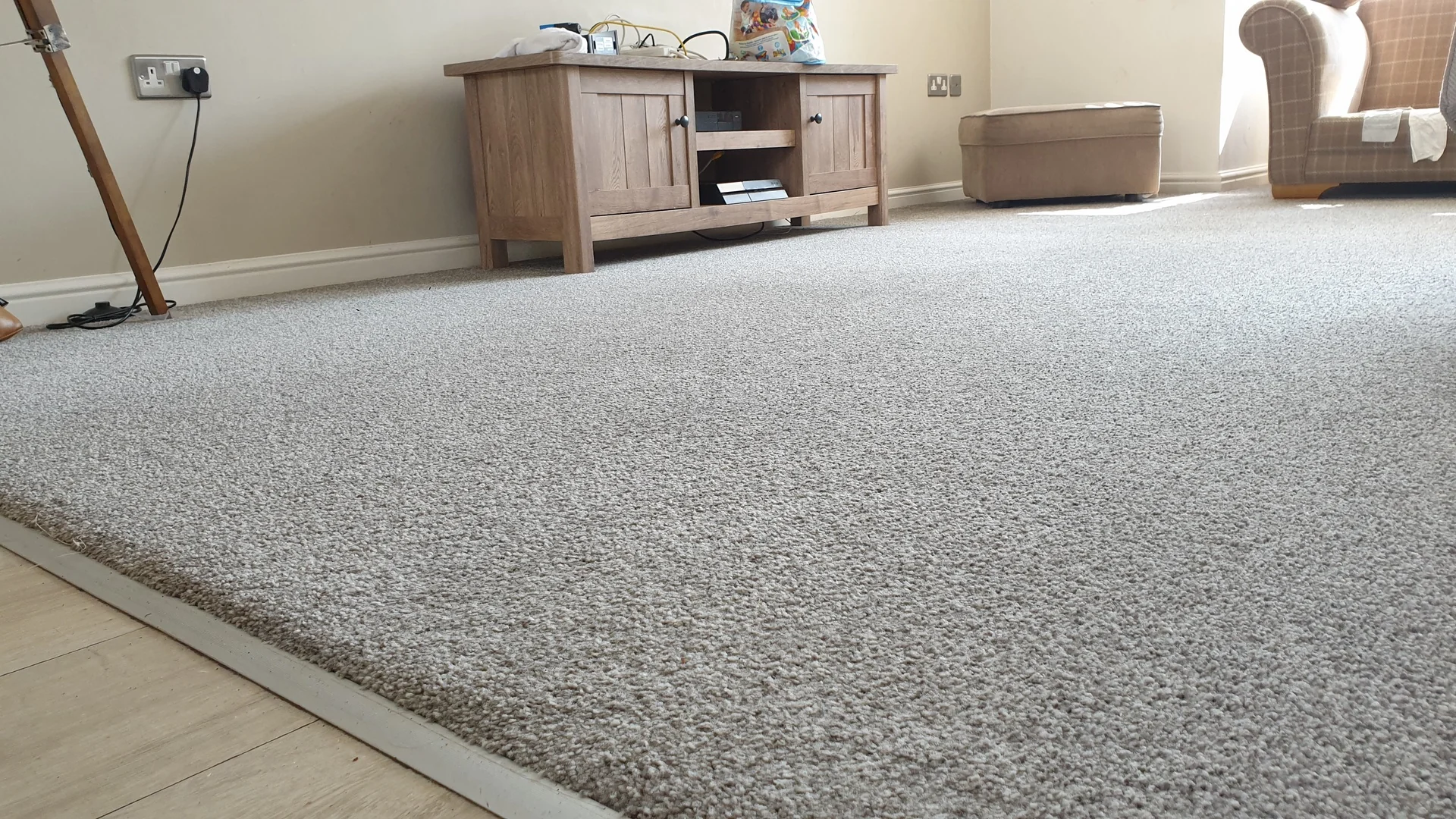 Freshly cleaned grey carpet in a living room