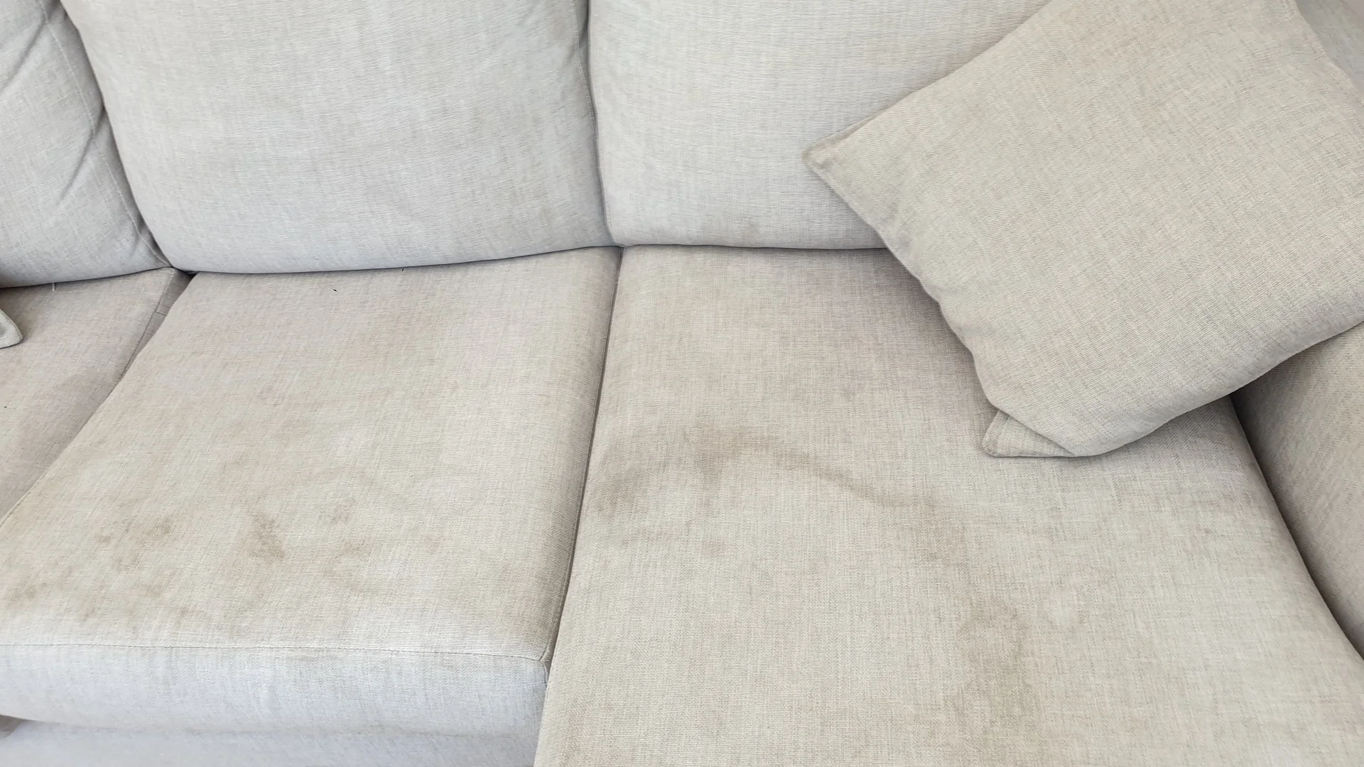 Grey sofa upholstery before professional cleaning